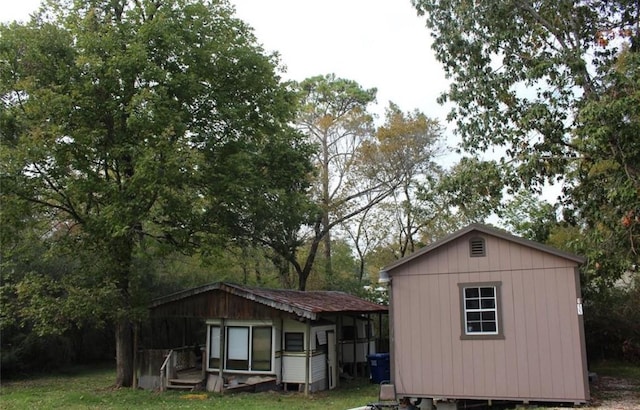 view of outdoor structure with a lawn