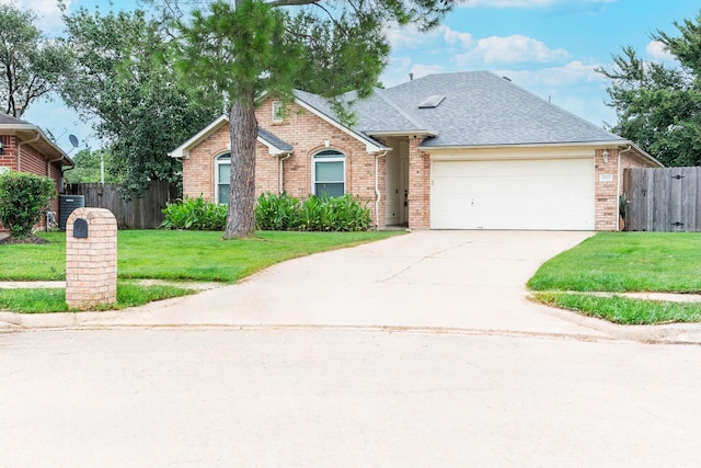 view of front facade with a garage and a front lawn