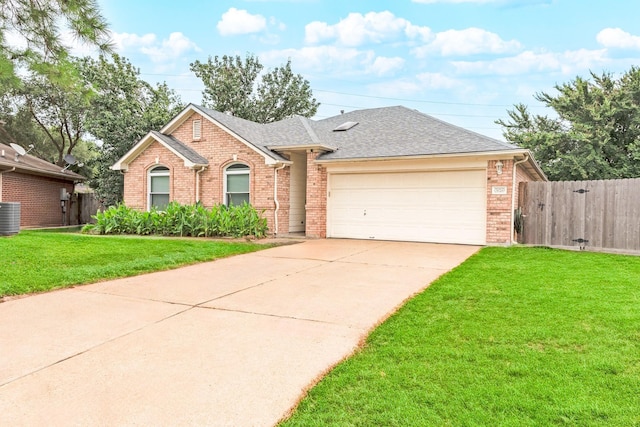 ranch-style home with central air condition unit, a front lawn, and a garage