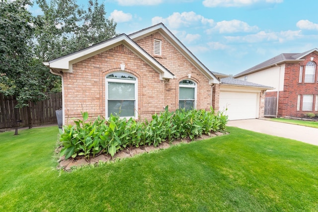 view of front of house featuring a front yard and a garage