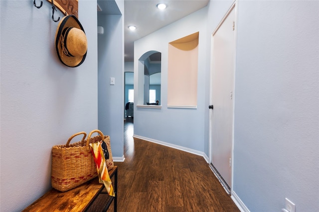 corridor featuring dark hardwood / wood-style flooring