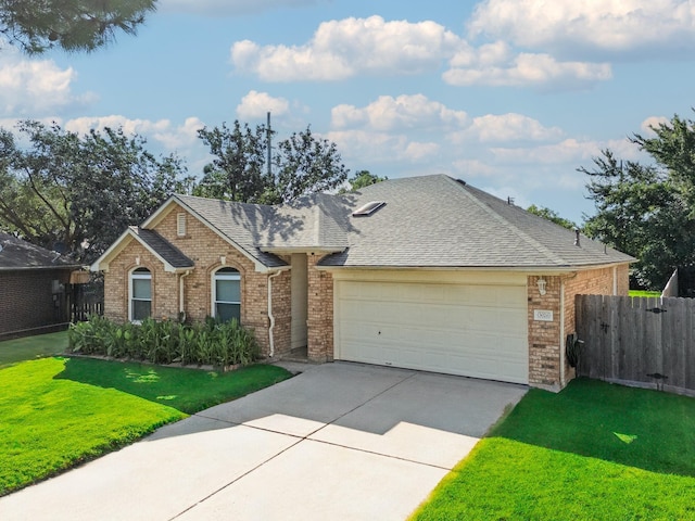 ranch-style house with a garage and a front yard