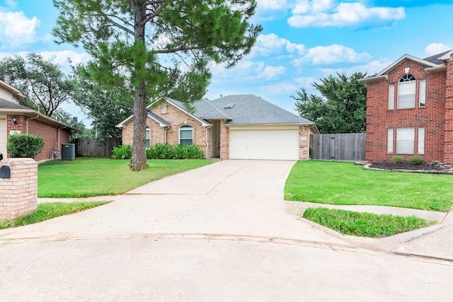 front of property featuring a garage, a front yard, and central AC