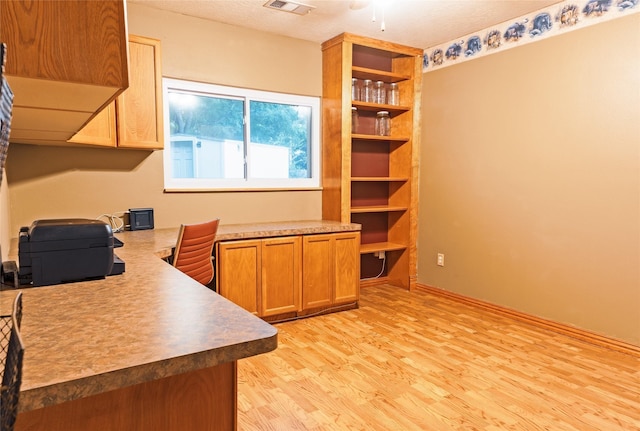 office area with light hardwood / wood-style flooring