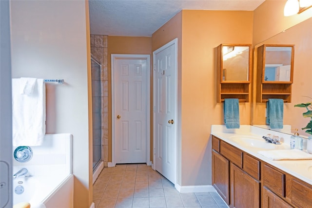 bathroom featuring tile patterned floors, vanity, a textured ceiling, and plus walk in shower