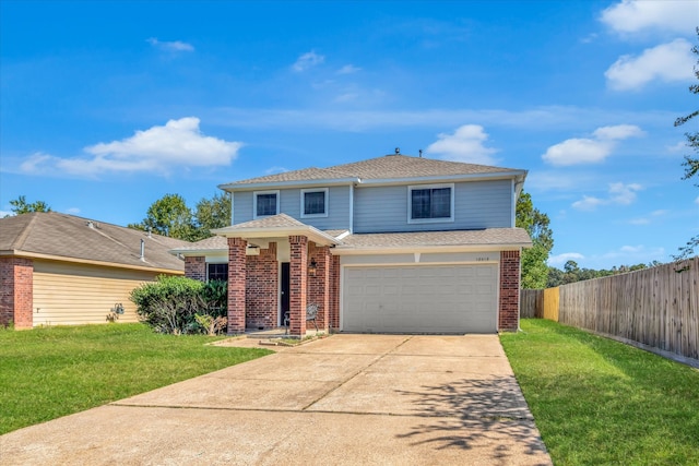 view of front property featuring a front yard and a garage