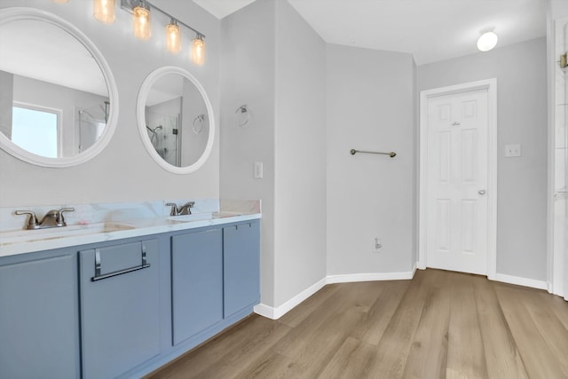 bathroom with vanity and hardwood / wood-style floors