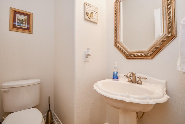 bathroom with toilet and sink