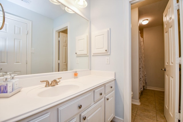 bathroom featuring tile patterned flooring, vanity, toilet, and a shower with curtain