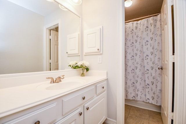 bathroom featuring a shower with shower curtain, tile patterned flooring, and vanity