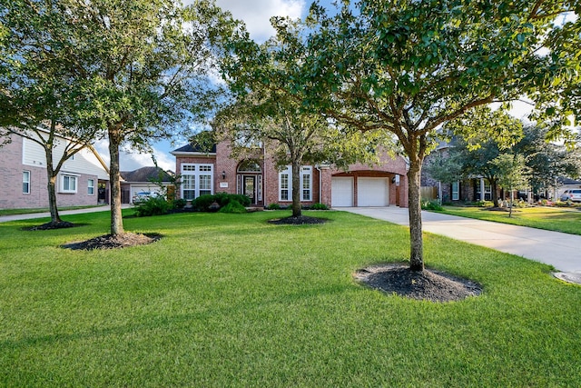 view of front of house featuring concrete driveway, a front yard, a garage, and brick siding
