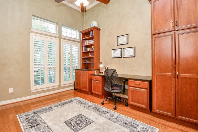 home office with ceiling fan, light hardwood / wood-style flooring, and plenty of natural light