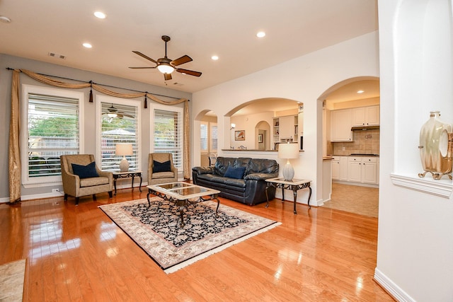 living room with ceiling fan, light wood-type flooring, visible vents, recessed lighting, and baseboards