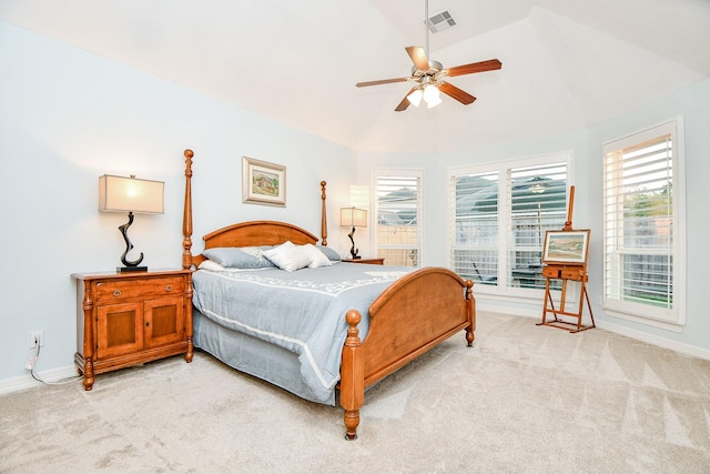 bedroom featuring lofted ceiling, visible vents, baseboards, and light carpet