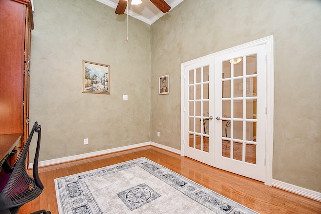 office with ceiling fan, french doors, light hardwood / wood-style floors, and ornamental molding