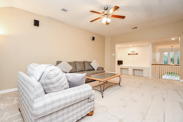 living room with ceiling fan and light carpet