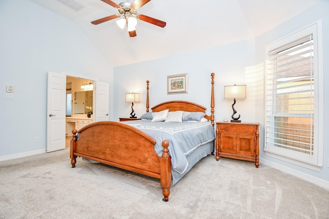 bedroom with ensuite bathroom, ceiling fan, lofted ceiling, and light carpet