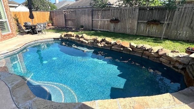 view of pool featuring a patio area, a fenced in pool, and a fenced backyard