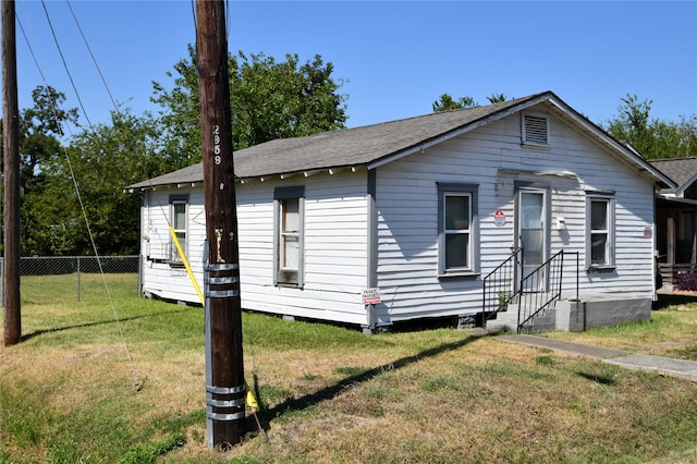 view of front of home with a front yard