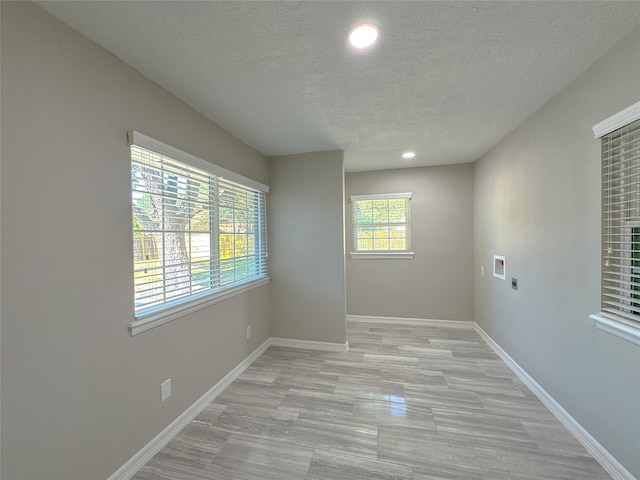 spare room featuring a textured ceiling