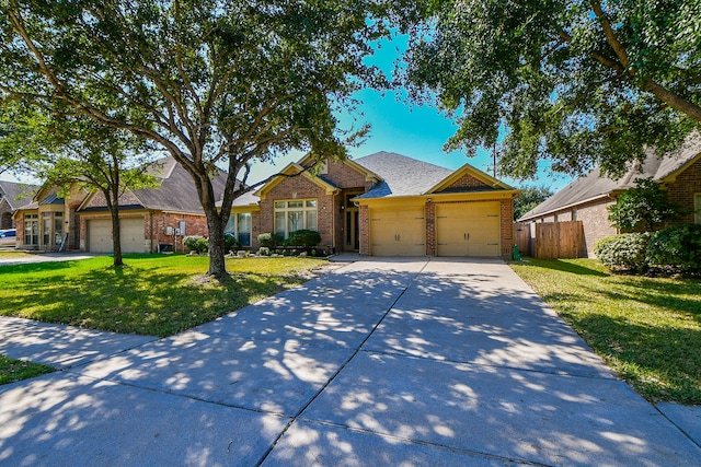 view of front of home featuring a front lawn and a garage