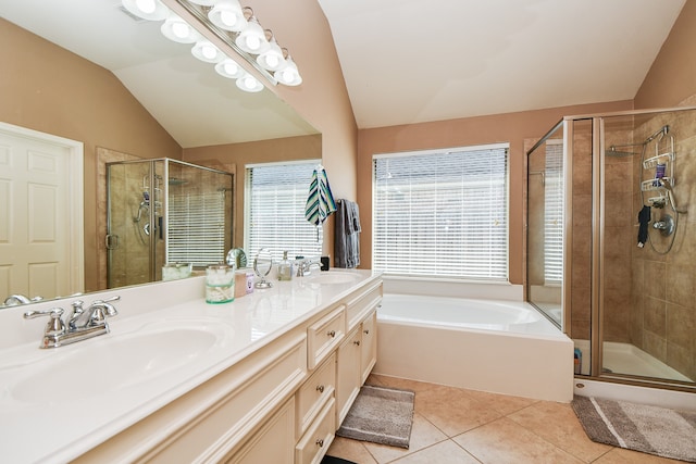 bathroom with lofted ceiling, tile patterned flooring, vanity, and independent shower and bath