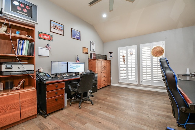 office space featuring lofted ceiling, ceiling fan, and light hardwood / wood-style flooring