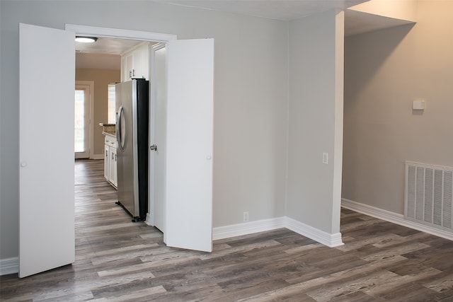 unfurnished room with hardwood / wood-style floors