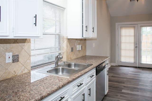 kitchen featuring dark hardwood / wood-style flooring, white cabinets, sink, and stainless steel dishwasher