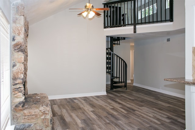 unfurnished living room with high vaulted ceiling, ceiling fan, and dark hardwood / wood-style floors