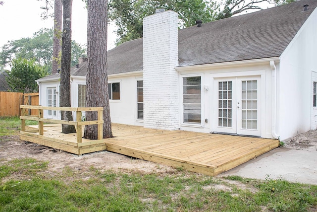 back of house with french doors and a deck