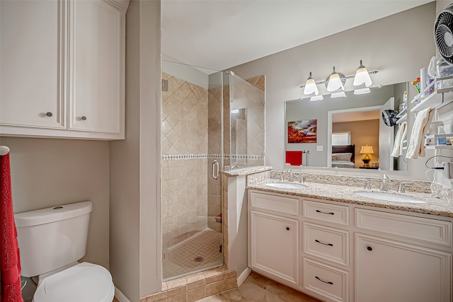 bathroom with tile patterned flooring, vanity, toilet, and walk in shower