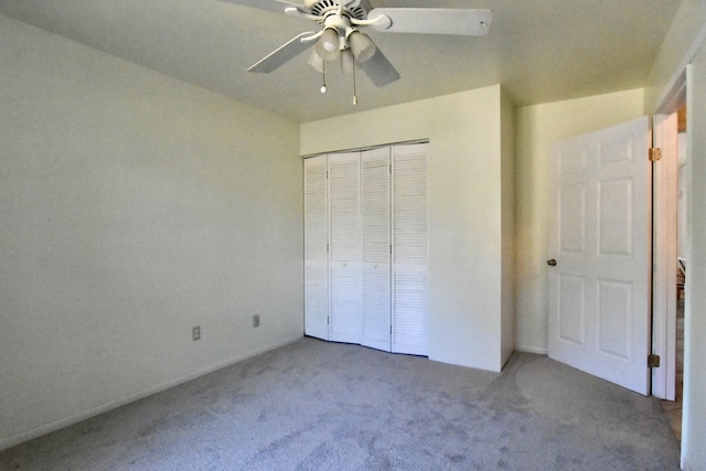 unfurnished bedroom featuring carpet floors, a closet, and ceiling fan