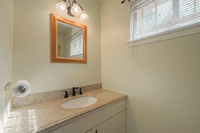 bathroom featuring vanity and a healthy amount of sunlight