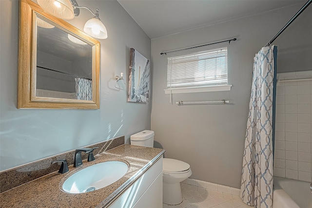 full bathroom featuring shower / bath combo with shower curtain, tile patterned flooring, vanity, and toilet