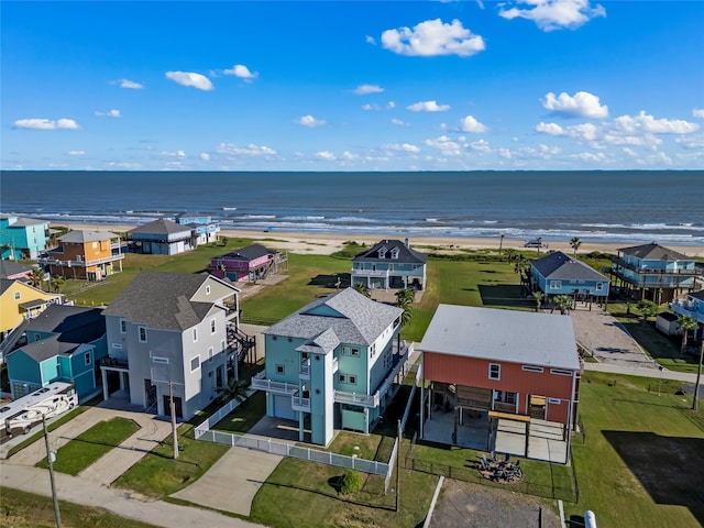 bird's eye view with a water view and a view of the beach