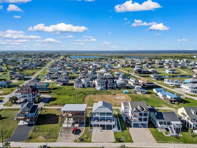 bird's eye view featuring a residential view and a water view