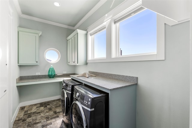 washroom featuring independent washer and dryer, crown molding, and cabinets