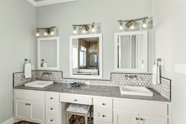 bathroom featuring vanity, backsplash, and ornamental molding