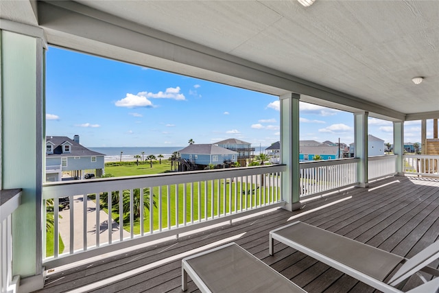 wooden deck with a water view