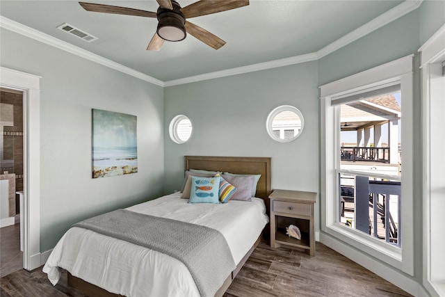 bedroom featuring ornamental molding, dark hardwood / wood-style floors, and ceiling fan