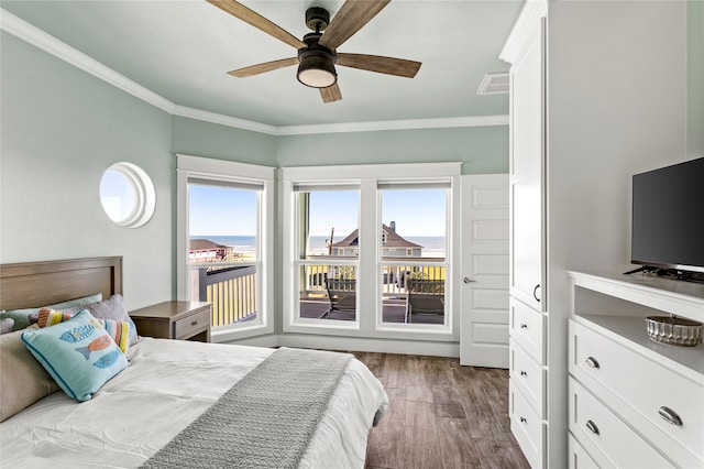 bedroom with ceiling fan, hardwood / wood-style flooring, and ornamental molding