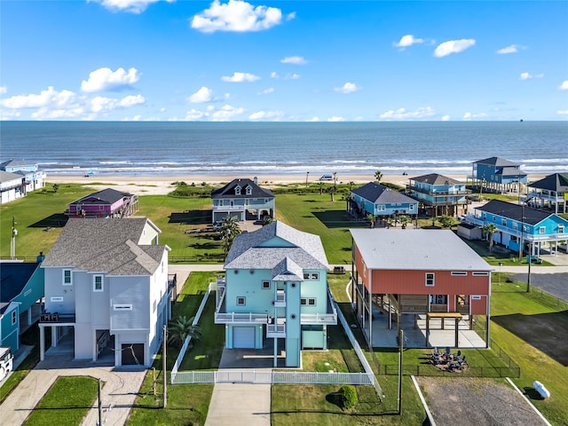 aerial view with a water view and a view of the beach