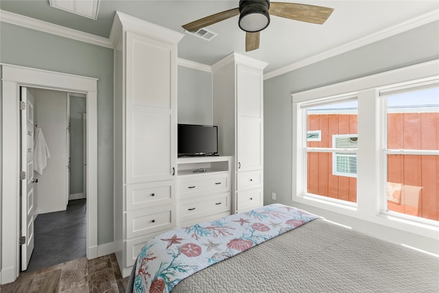 bedroom featuring ceiling fan, crown molding, and dark hardwood / wood-style floors