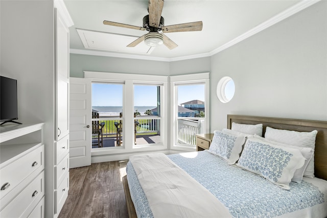 bedroom with ornamental molding, a water view, dark hardwood / wood-style floors, and ceiling fan