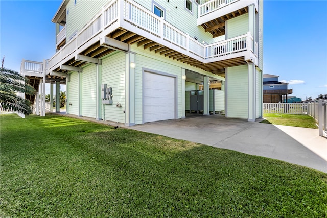 view of property exterior featuring a garage, a lawn, and a balcony