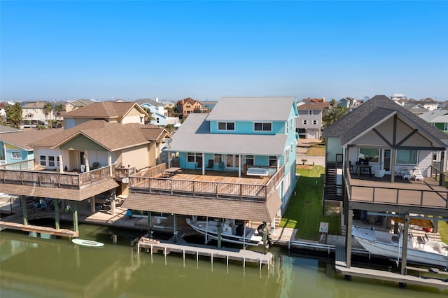 back of house with a deck with water view