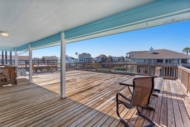 wooden terrace with a residential view