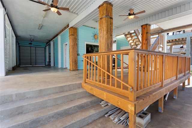 staircase featuring concrete flooring and ceiling fan