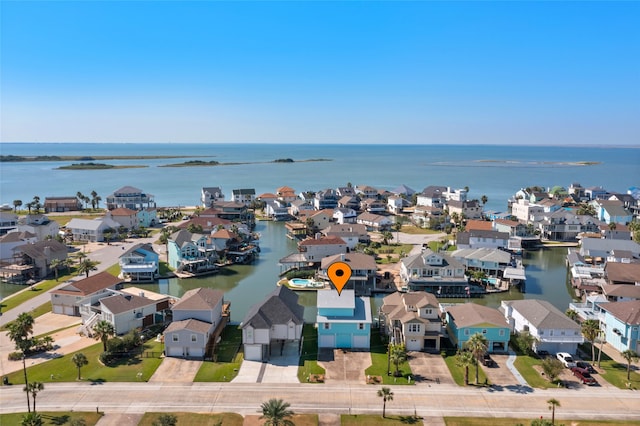 bird's eye view featuring a water view and a residential view